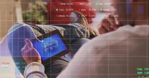 Image of financial data processing over caucasian man using tablet Stock Photos