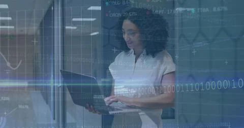Image of financial data processing over businesswoman using computer Foto stock