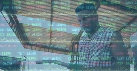 Image of financial data processing over man at the gas station Stock Photos