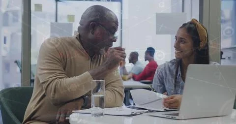 Image of financial data processing over diverse business people at office Stock Photos