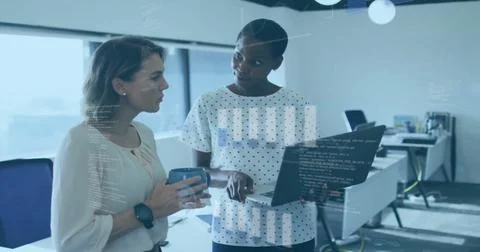 Image of financial data processing over diverse female colleagues using laptop Foto stock