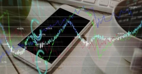 Image of financial data processing over smartphone on desk 写真素材