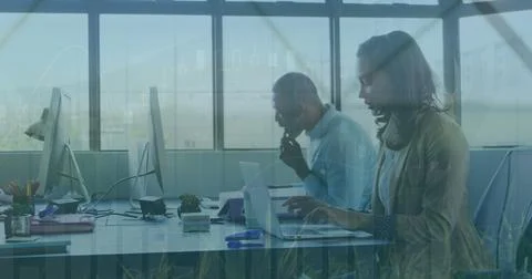 Image of financial data processing over diverse business people in office 写真素材