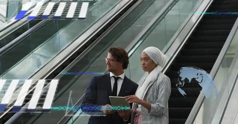 Image of financial data processing over diverse business people on escalator Foto stock
