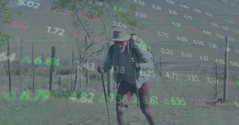 Image of financial data processing over african american man walking in nature Stock Photos