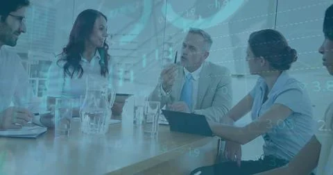 Image of financial data processing over diverse business people having meeting Foto stock