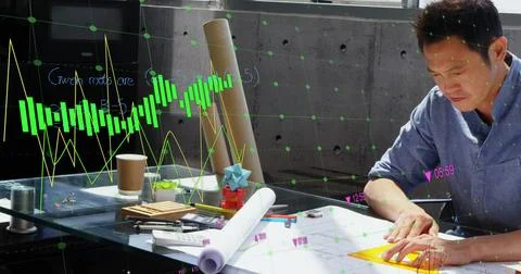 Image of financial data processing over asian businessman working in office Foto stock