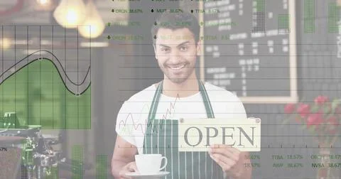 Image of financial data processing over smiling man in cafe holding open sign Foto stock