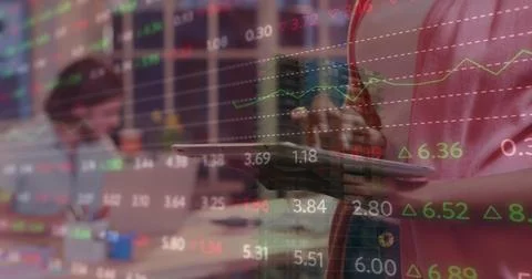 Image of financial data processing over caucasian businesswoman using tablet at Foto stock