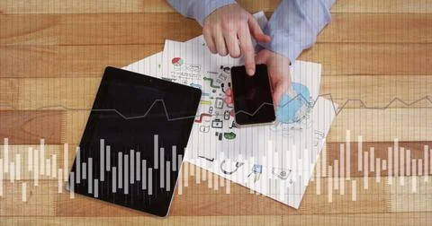 Image of financial data processing over caucasian man using tablet and Stock Photos