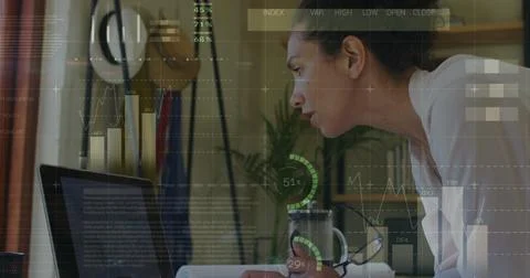 Image of financial data processing over biracial businesswoman using laptop in 스톡 사진