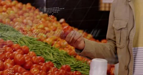 Image of financial data processing over caucasian man grocery shopping Stockfoto's