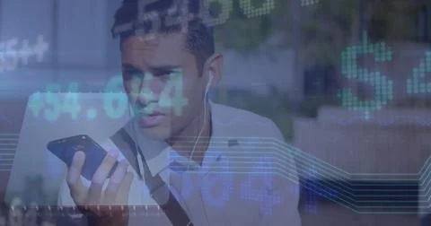 Image of financial data processing over man using smartphone 库存照片