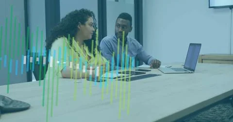 Image of financial data processing over diverse business people in office 写真素材