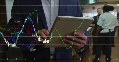 Image of financial data processing over businessman using tablet Foto stock