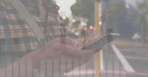 Image of financial data processing over caucasian man with smartphone on the go Stock Photos