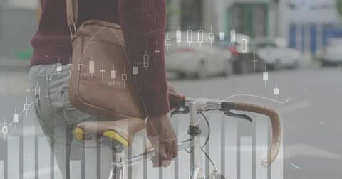 Image of financial data processing over african american man with bike on the go 写真素材