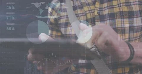 Image of financial data processing over caucasian man with tablet on the go 写真素材