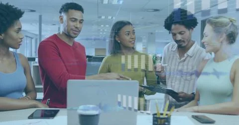 Image of financial data processing over diverse business people in office 写真素材