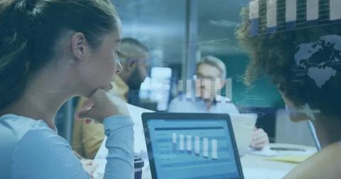 Image of financial data processing over diverse business people in office Foto stock