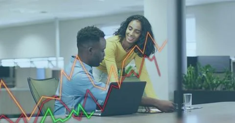 Image of financial data processing over diverse colleagues discussing work in 写真素材