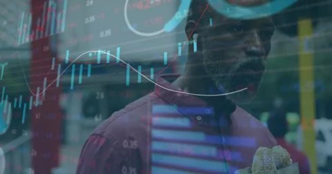 Image of financial data processing over african american man eating sandwich in Stock Photos