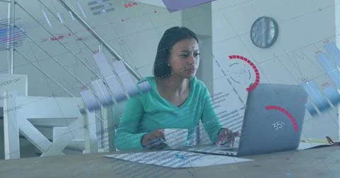 Image of financial data processing over biracial woman using laptop Foto stock