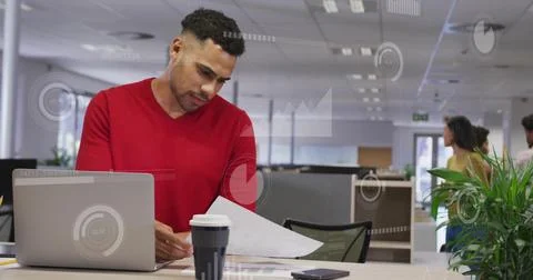Image of financial data processing over biracial businessman using laptop in 写真素材