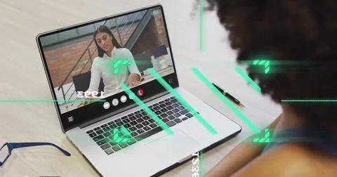 Image of financial data processing over diverse business people on laptop image Foto stock