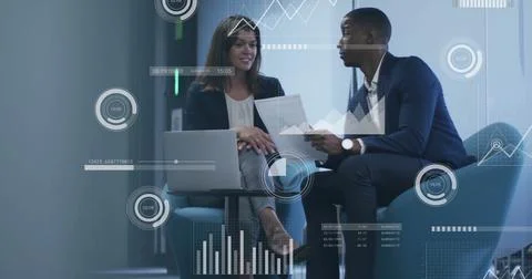Image of financial data processing over diverse business people in office Foto stock