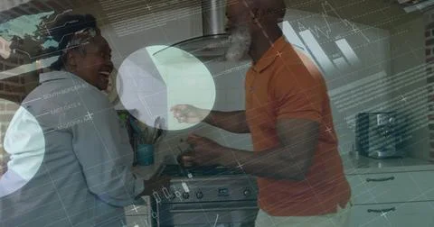 Image of financial data processing over senior african american couple dancing Stock Photos