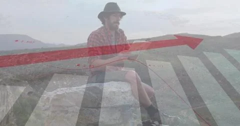 Image of financial data processing over caucasian man reading map in mountains Foto stock