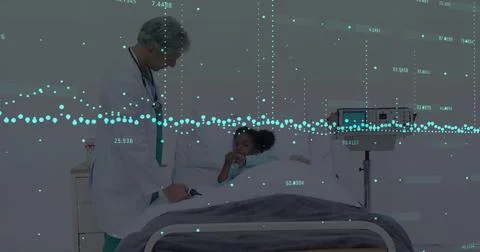 Image of financial data processing over diverse male doctor and child patient Stock Photos