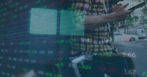 Image of financial data processing over caucasian man using tablet Foto stock