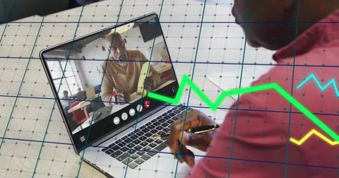 Image of financial data processing over african american man on laptop video Stock Photos