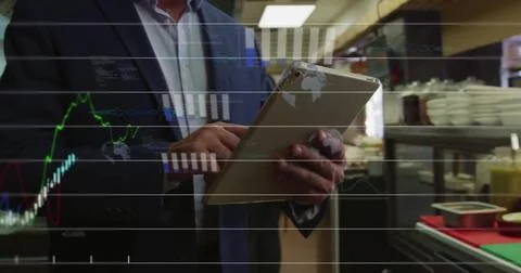 Image of financial data processing over caucasian man using tablet Foto stock