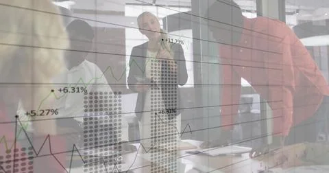 Image of financial data processing over diverse business people in office Foto stock