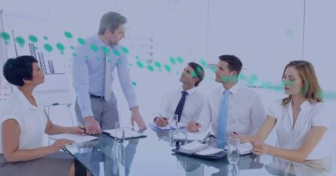 Image of financial data processing over diverse business people in meeting in Foto stock