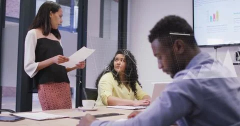 Image of financial data processing over diverse business people in office Stockfoto's