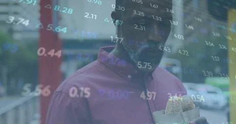 Image of financial data processing over african american man eating Stock Photos