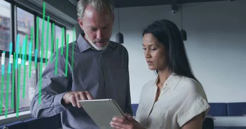 Image of financial data processing over diverse business people in office Stockfoto's