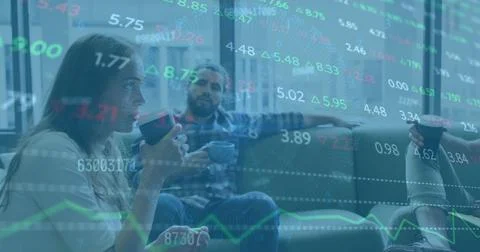 Image of financial data processing over diverse business people in office 写真素材