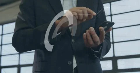 Image of financial data processing over biracial businessman using smartphone in 스톡 사진
