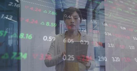 Image of financial data processing over asian businesswoman using tablet in Stockfoto's