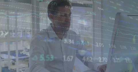 Image of financial data processing over caucasian businessman using computer in Stockfoto's