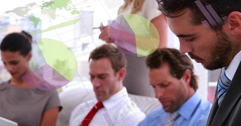 Image of financial data processing over diverse colleagues having meeting in Stock Photos