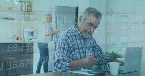 Image of financial data processing over senior man paying online using laptop Stock Photos