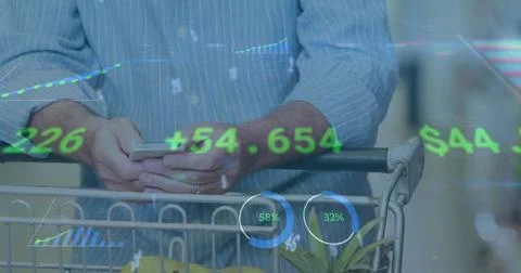 Image of financial data processing over man with shopping trolley using Foto stock