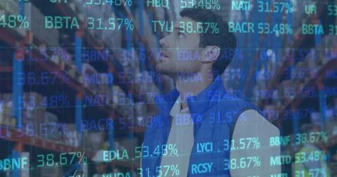 Image of financial data processing over man working in warehouse Foto stock
