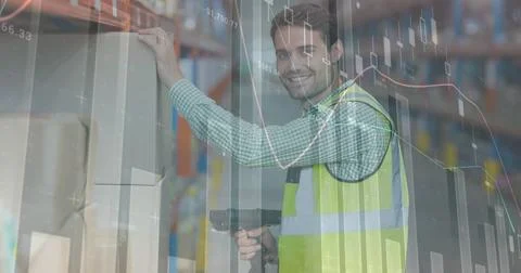 Image of financial data processing over smiling man working in warehouse Stock Photos